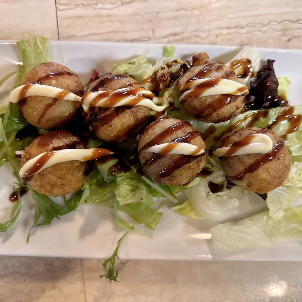 Takoyaki served fresh at a Japanese ramen, sushi, and Asian cuisine restaurant in Yukon.